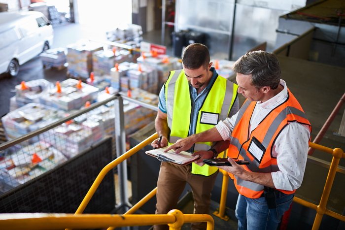 Transport coordinators reviewing a vehicle move