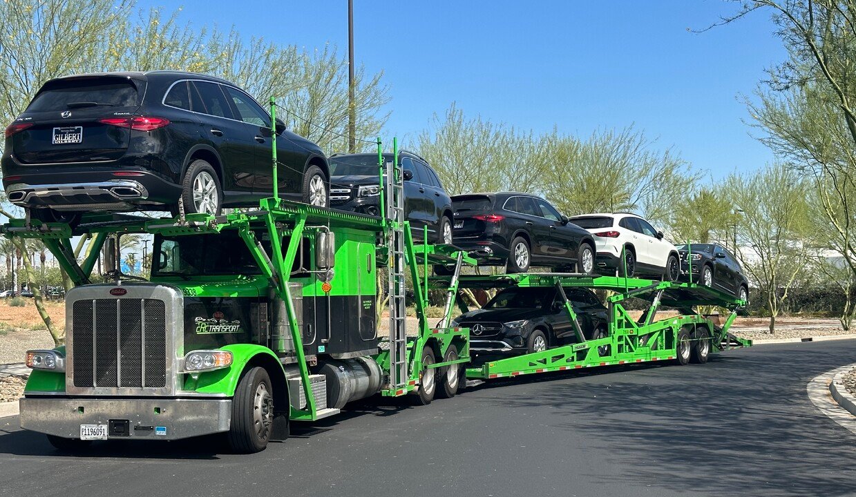 Open car carrier transporting vehicles on an American road